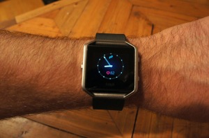 A close-up picture of the Fitbit Blaze default clock face.
